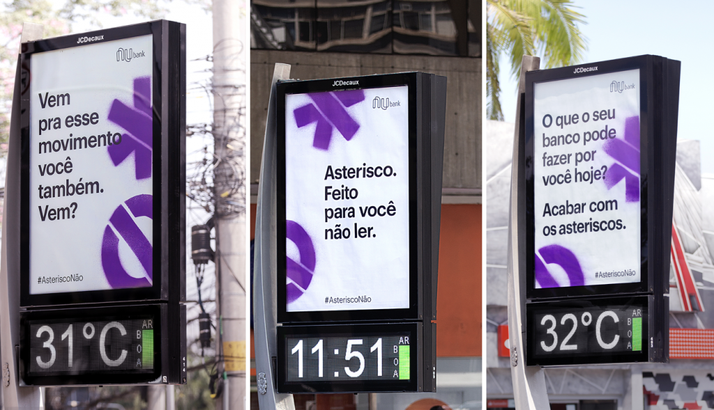 Mensagens do movimento AsteriscoNão em anúncios de relógio nas ruas de São Paulo. 