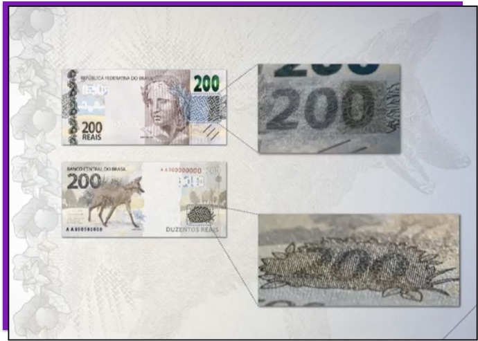 Detalhe da nota de 200 reais que mostra o número 200 escondido