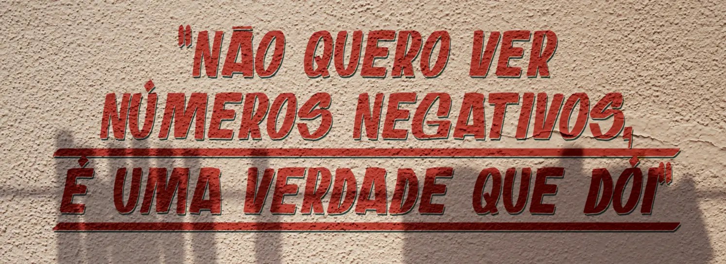 Imagem de um muro onde está escrito "Não quero ver números negativos, é uma verdade que dói"