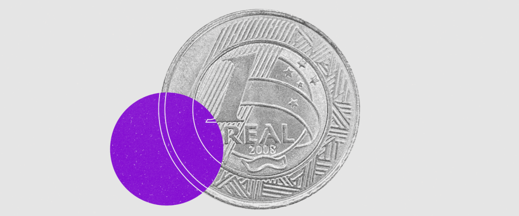 Ilustração de uma moeda de 1 real, com uma bola roxa sobre ela descentralizada.