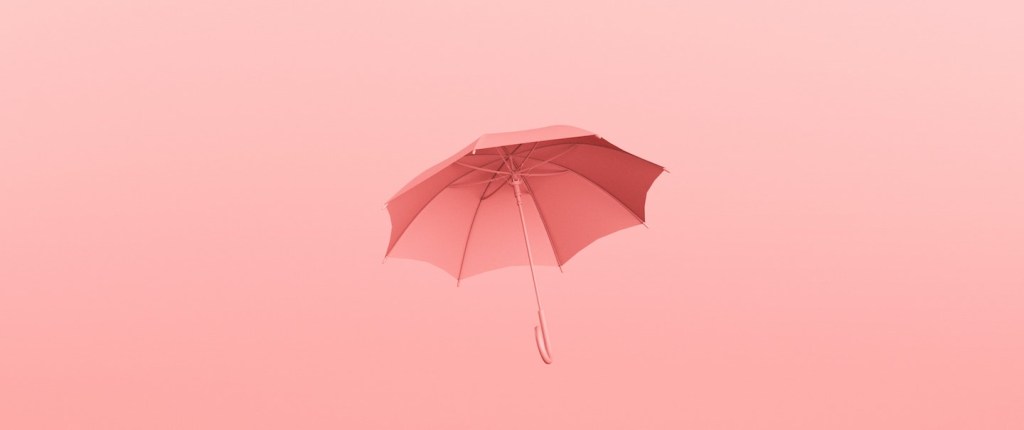 imagem de um guarda-chuva em tons de rosa em um fundo rosa. Foto: anunay rai